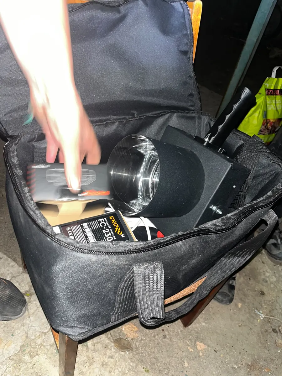 Spotlight in its carrying case